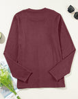 Judith Solid Exposed Seam Long Sleeve Top