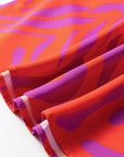 Abstract V-Neck Cuffed Short Sleeve Blouse