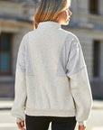 Solid Half-Zip Reverse Seam Pocketed Sweatshirt