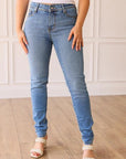 THE PARIS HIGH RISE LIGHT WASH SKINNY JEAN