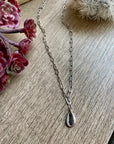 Shell pendant on paper clip chain choker