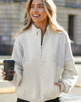 Solid Half-Zip Reverse Seam Pocketed Sweatshirt