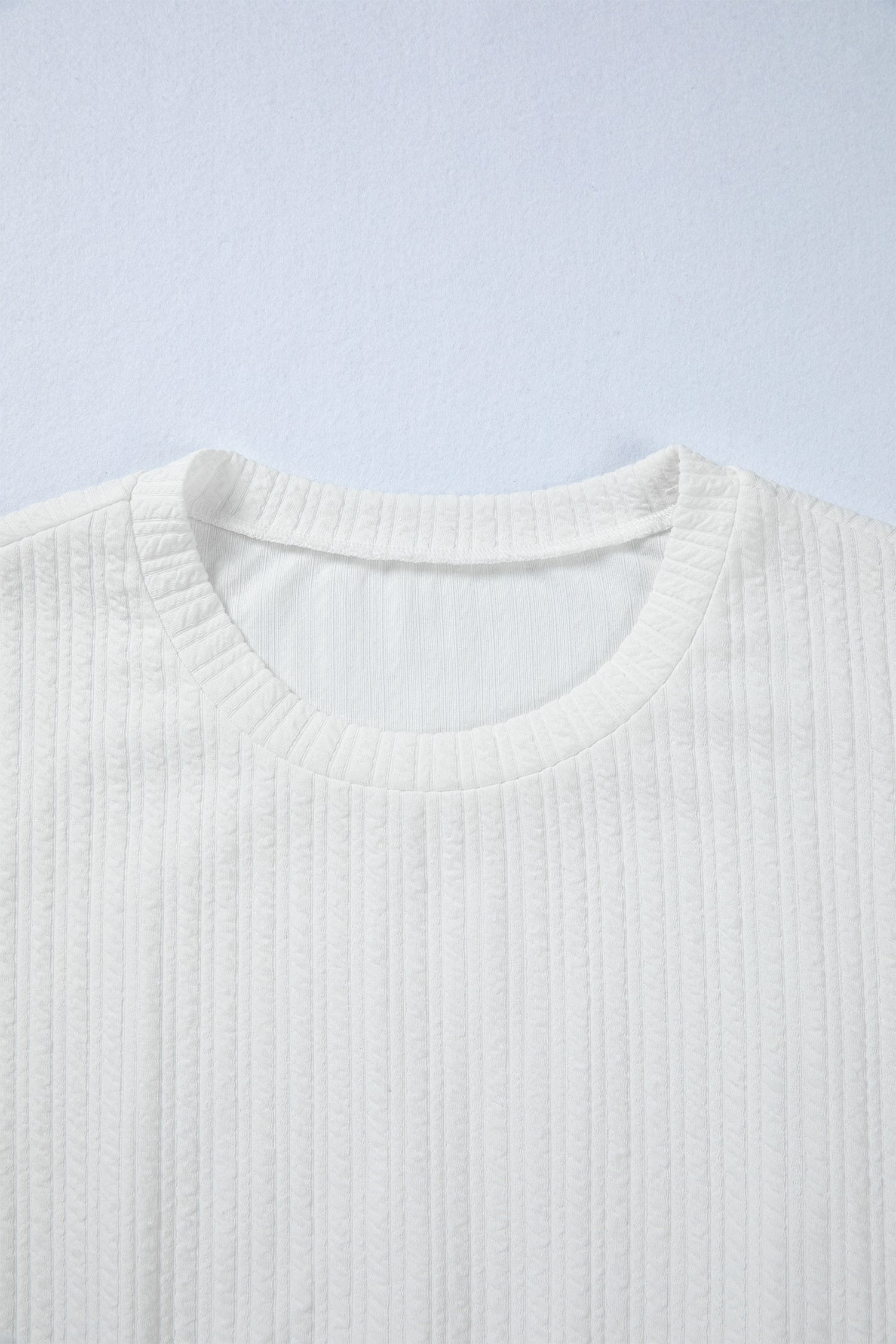 Solid Textured Drop Shoulder Peplum Top