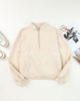 Solid Half-Zip Reverse Seam Pocketed Sweatshirt
