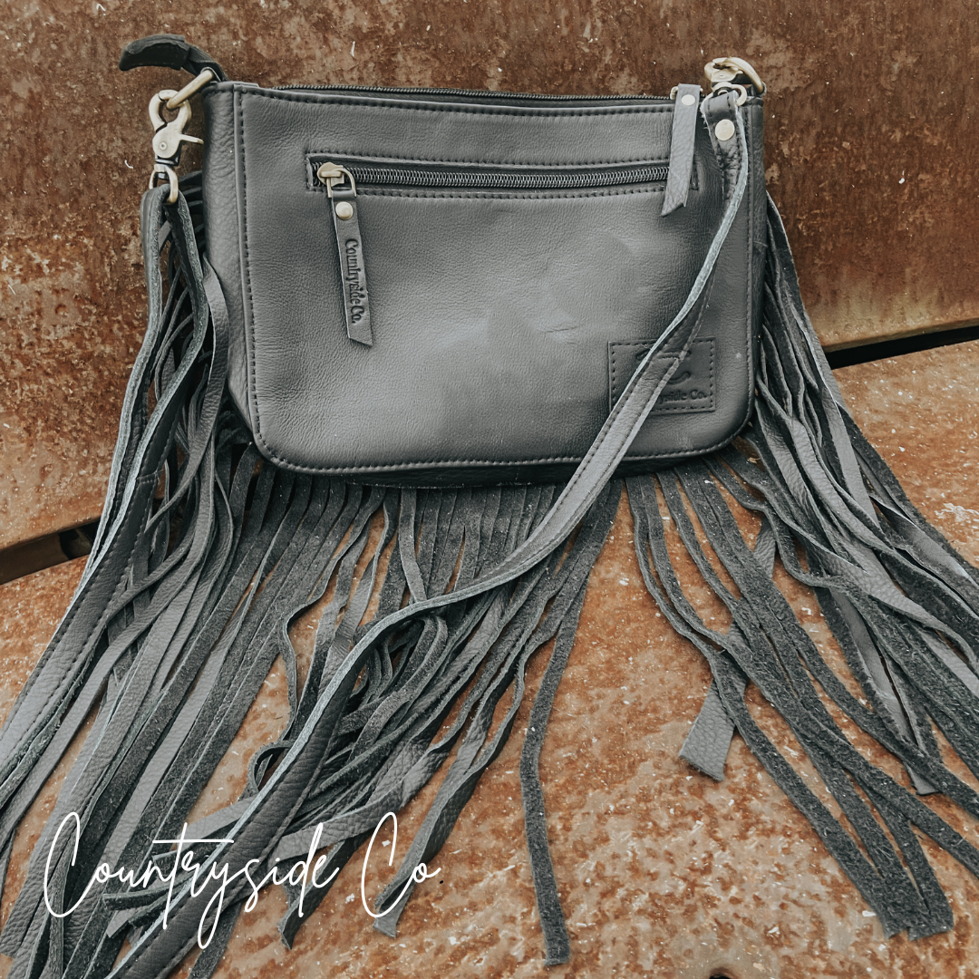 Western-Inspired Hand-Tooled Leather Purse With Fringed Edges And Detachable Strap