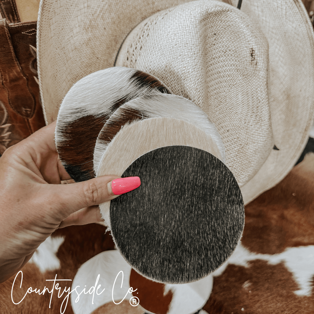 Naturally Toned Cowhide Coaster Set Featuring Unique Handcrafted Patterns For Everyday Use