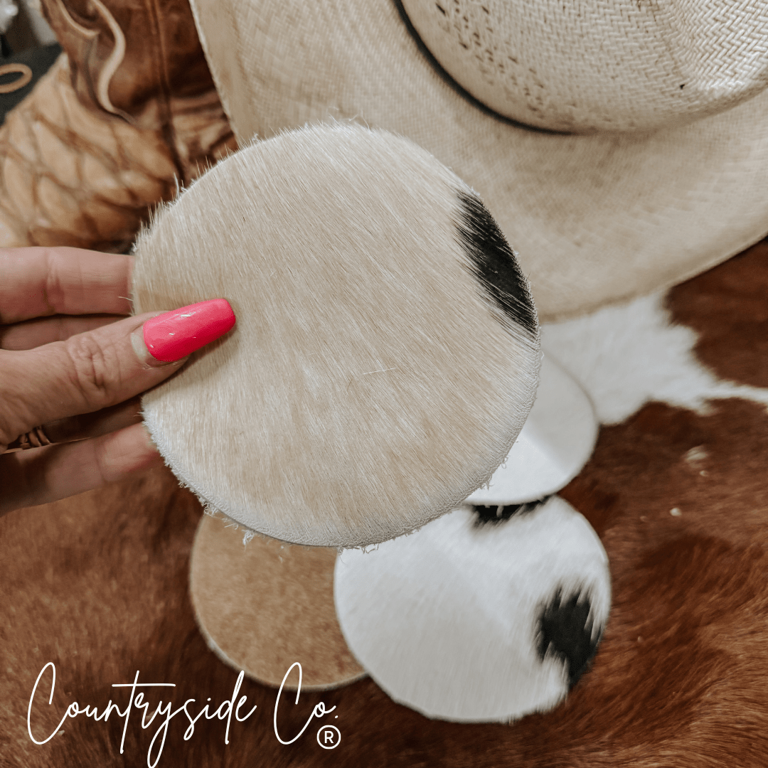 Naturally Toned Cowhide Coaster Set Featuring Unique Handcrafted Patterns For Everyday Use