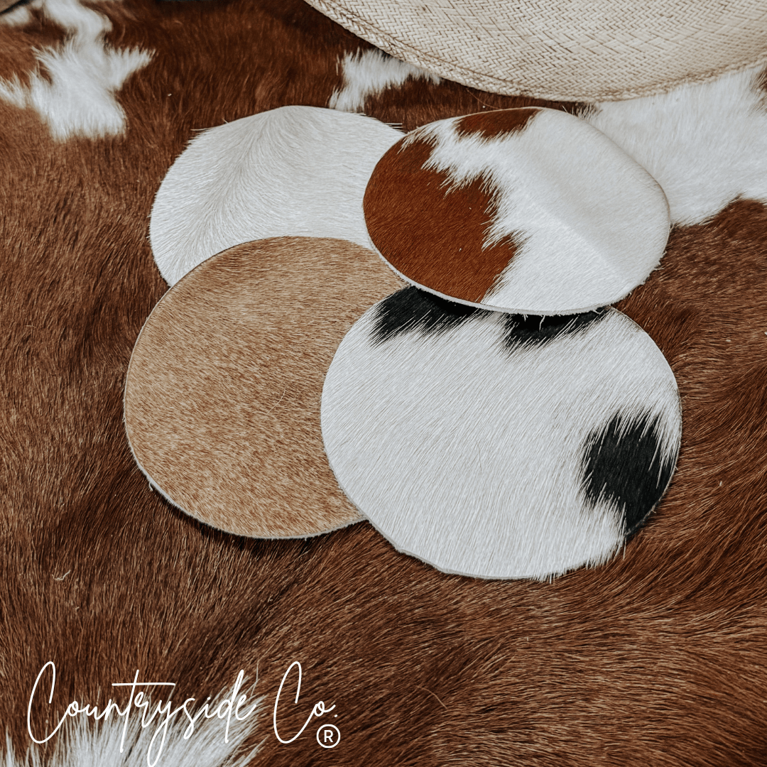 Naturally Toned Cowhide Coaster Set Featuring Unique Handcrafted Patterns For Everyday Use