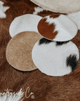 Naturally Toned Cowhide Coaster Set Featuring Unique Handcrafted Patterns For Everyday Use