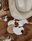 Naturally Toned Cowhide Coaster Set Featuring Unique Handcrafted Patterns For Everyday Use