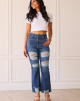 THE BLAKE MID WASHED MID RISE DISTRESSED CROP FLARE