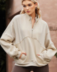 Solid Half-Zip Reverse Seam Pocketed Sweatshirt